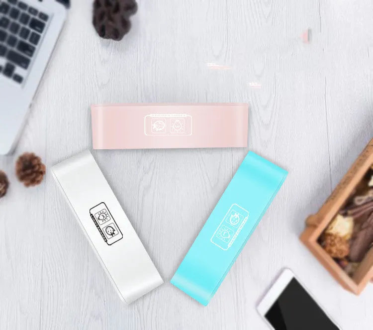 Blue rectangular LED atmosphere light alarm clock with digital display on bedside table