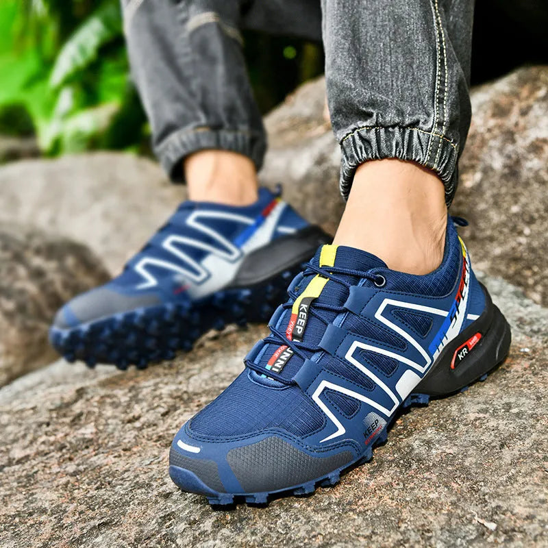 Men's grey orange and black white wide fit casual running shoes with low top design.
