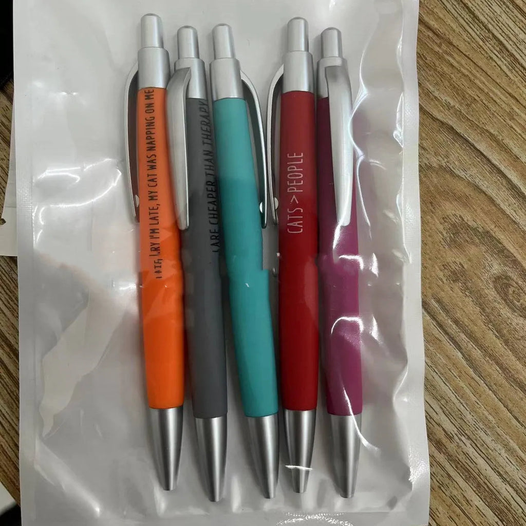 Five automatic push-action pens with animal designs and beaded storage bag