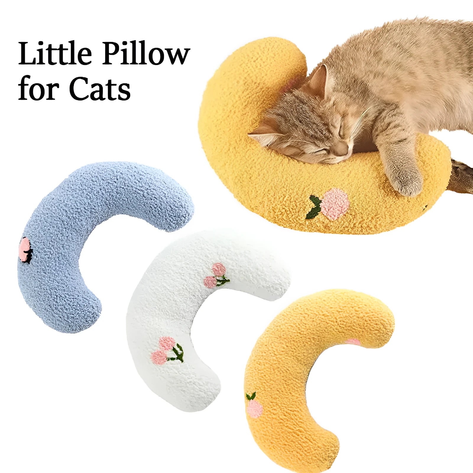 Small white blue yellow U-shaped plush pillow for cats and small dogs on a bed.