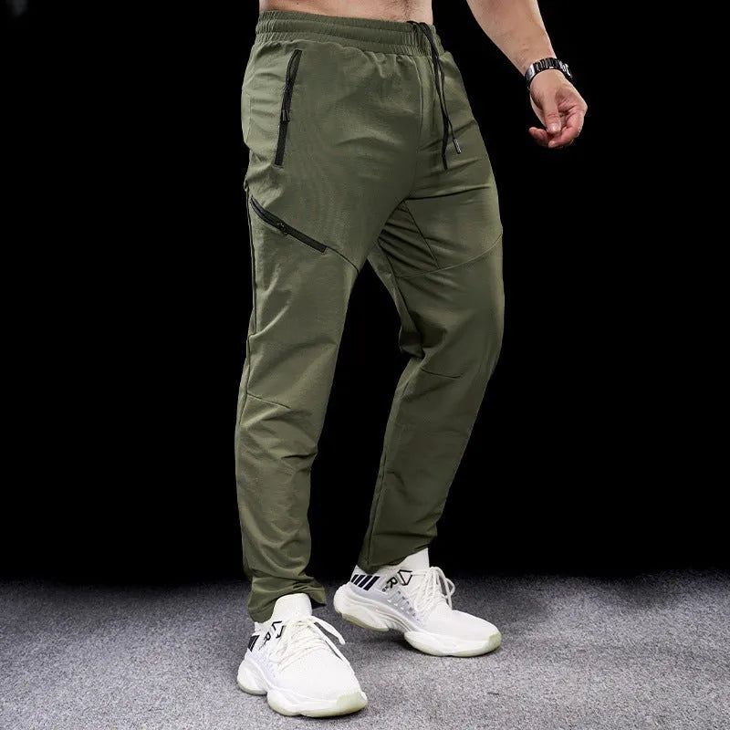 Men's black waterproof quick-drying workout pants with mid waist design for sports and fitness
