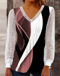 Purple loose fit V-neck lace top with long sleeves and hollow-out detail on a hanger.