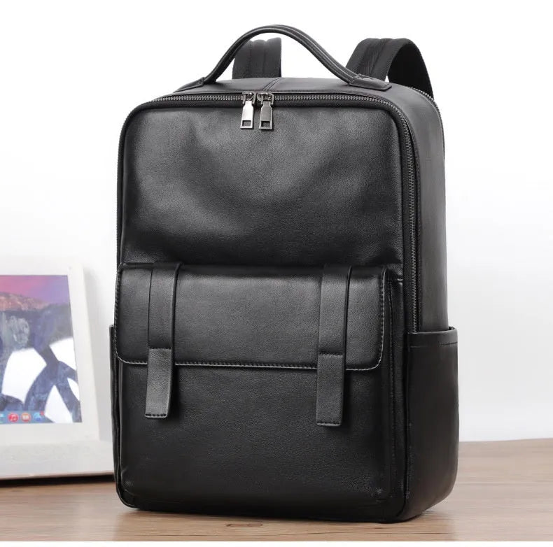 Men's black leather computer backpack with woven detailing and substantial 36-55 litre capacity