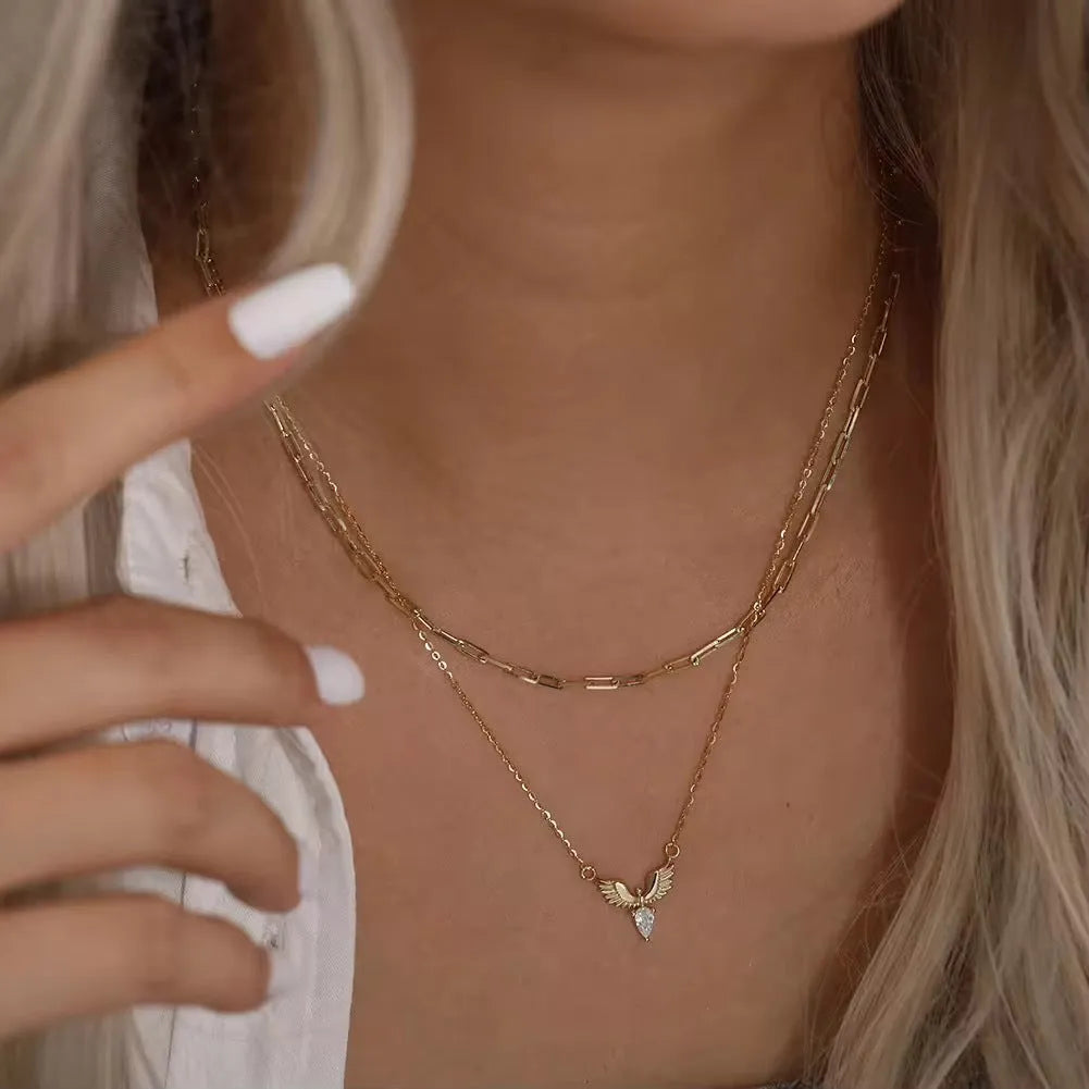 Close-up of a women's silver eagle pendant necklace on an O-ring chain with adjustable length.