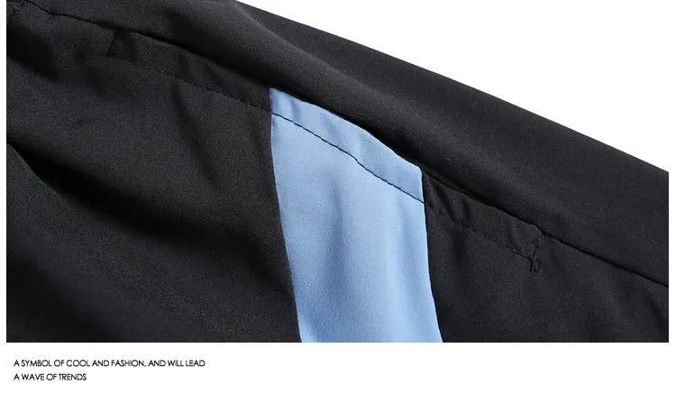Black loose-fit quick-dry sports shorts with an elastic waistband on a manikin.