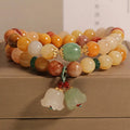 Women's natural jade multi-layer bracelet with orchid pendant detailing and jinsi construction