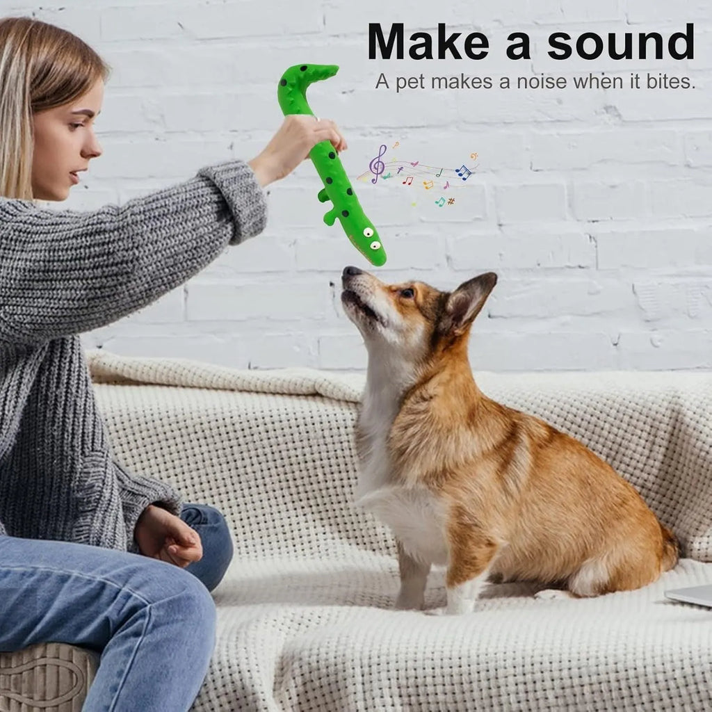 Green cartoon lizard-shaped dog chew toy with squeaker function on white background
