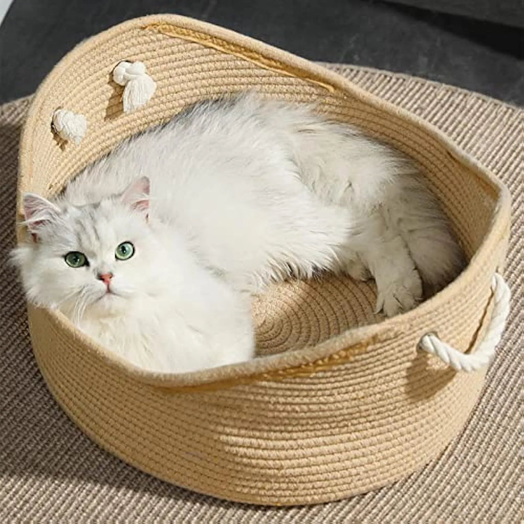 Wicker-style cat bed basket with a corrugated scratching board inside.