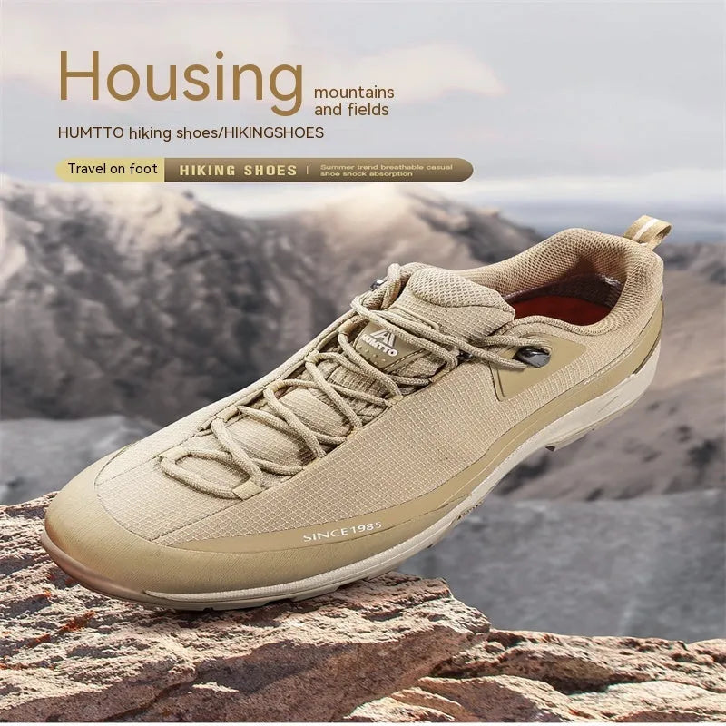 Men's low-top mountain climbing shoes in black with non-slip rubber soles and lace-up front closure