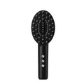 Black scalp medicine supplying device with vibration massage function on white background