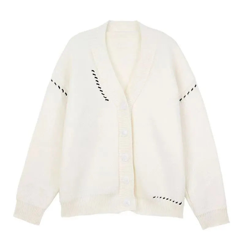 Women's loose black knitted cardigan with long sleeves on hanger