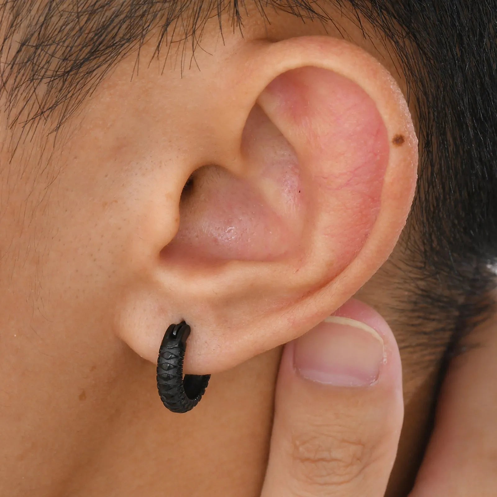 Stainless steel men's earrings with snake pattern design in black and gold colour options