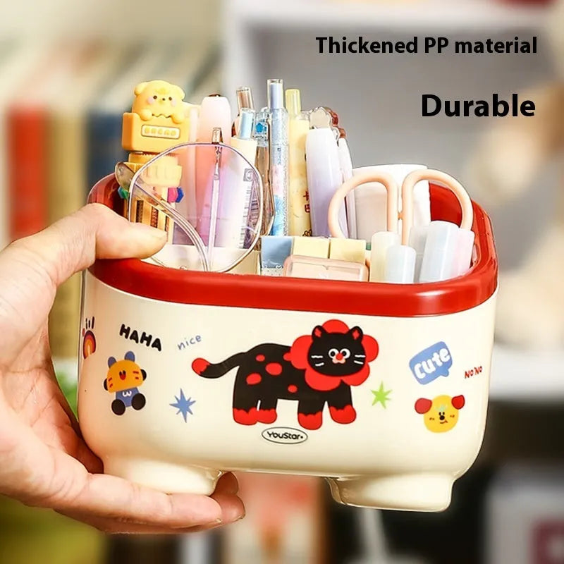 Cartoon style desktop storage organiser with multiple compartments including pen holders, storage boxes and flap trash can