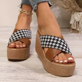 Brown and black plaid wedge sandals with a cross-leopard pattern and a low rubber sole.