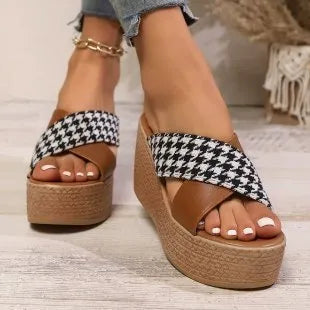Brown and black plaid wedge sandals with a cross-leopard pattern and a low rubber sole.