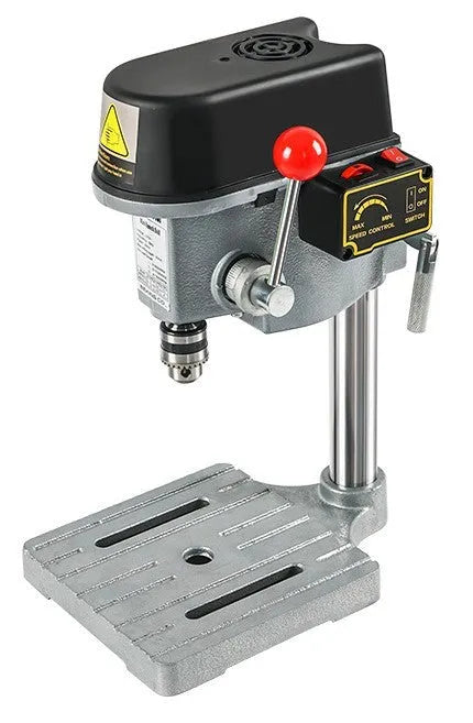 Mini bench drill and milling machine with included 1050W drill and metal bench pliers on a workbench.
