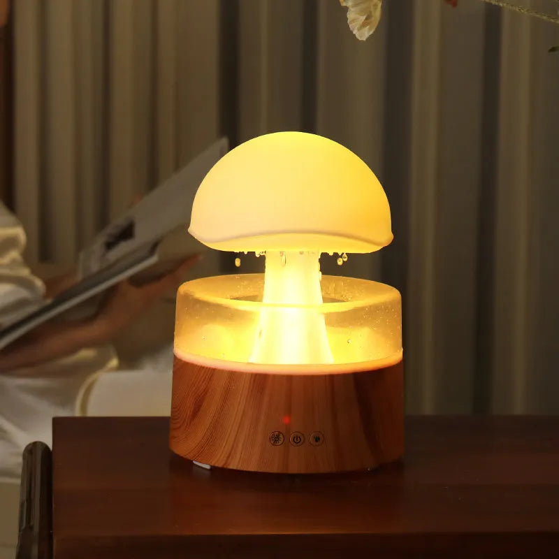 White rain cloud shaped humidifier and aroma diffuser with LED lighting and rainfall simulation