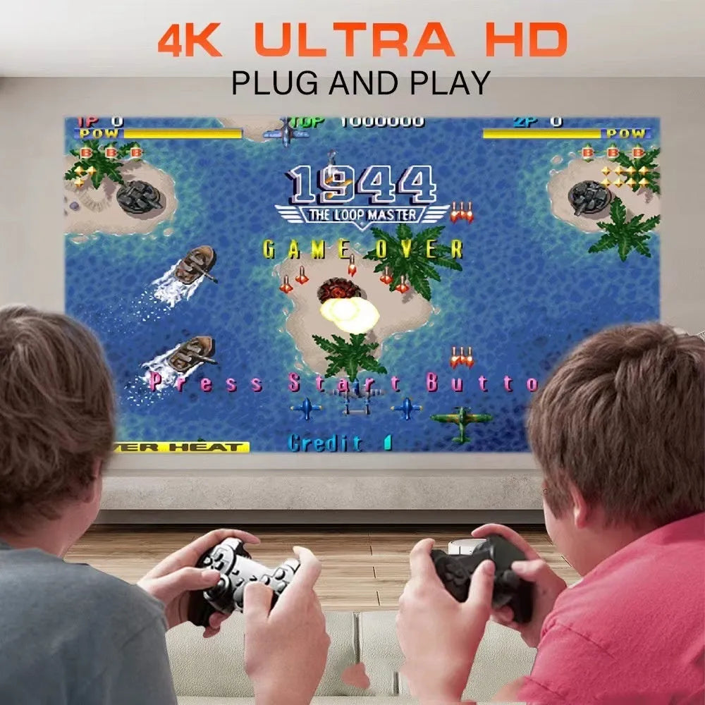 White home projector with carrying handle on a table, set up for wireless gaming projection.