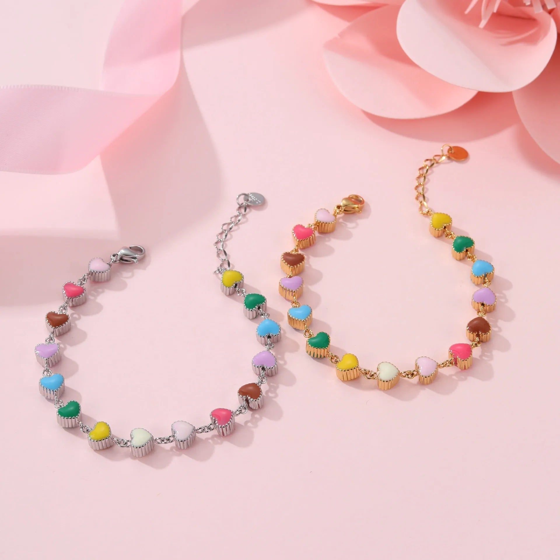 Gold plated women's bracelet with love heart pendant on titanium steel chain