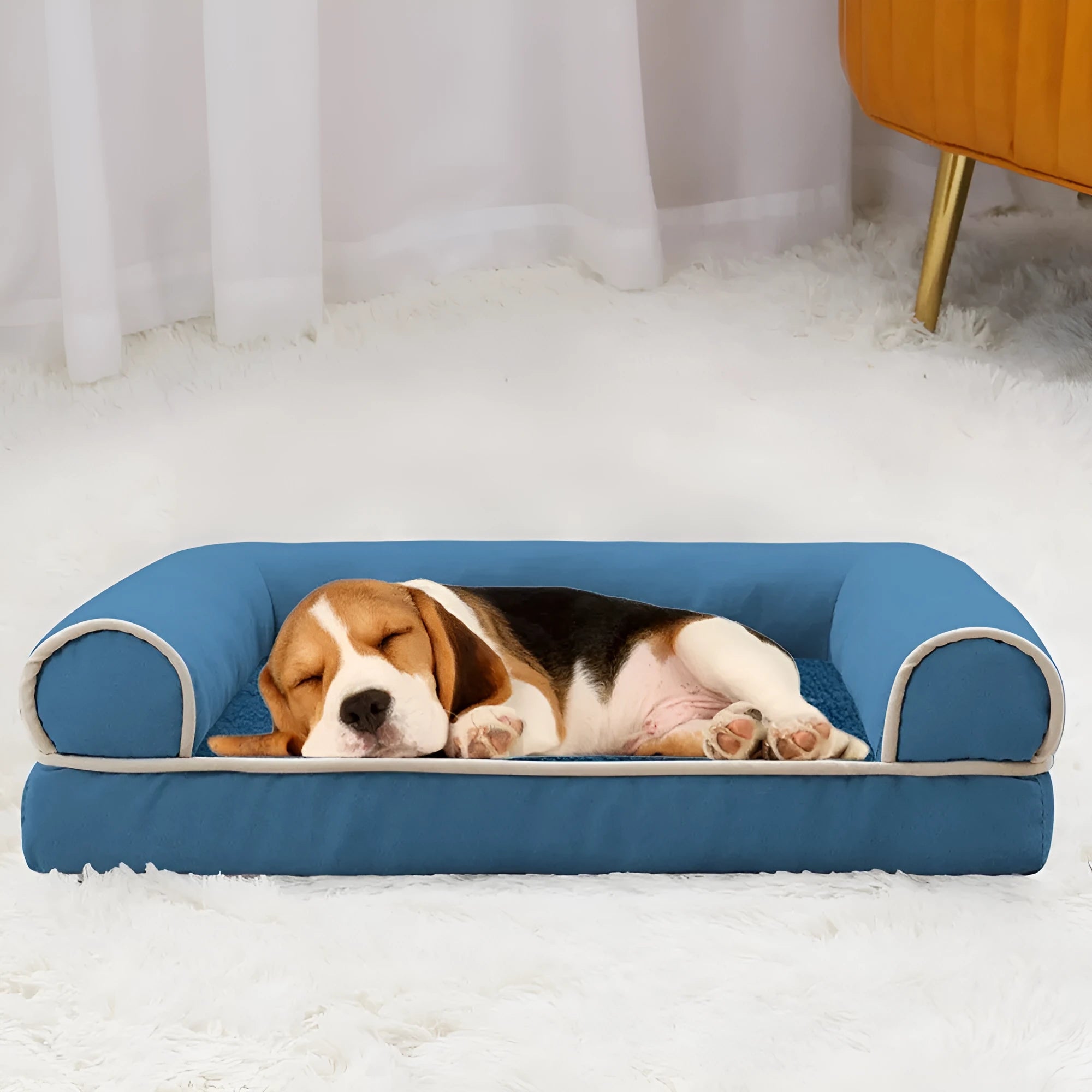Square blue cloth dog bed with sponge fill on a wooden floor