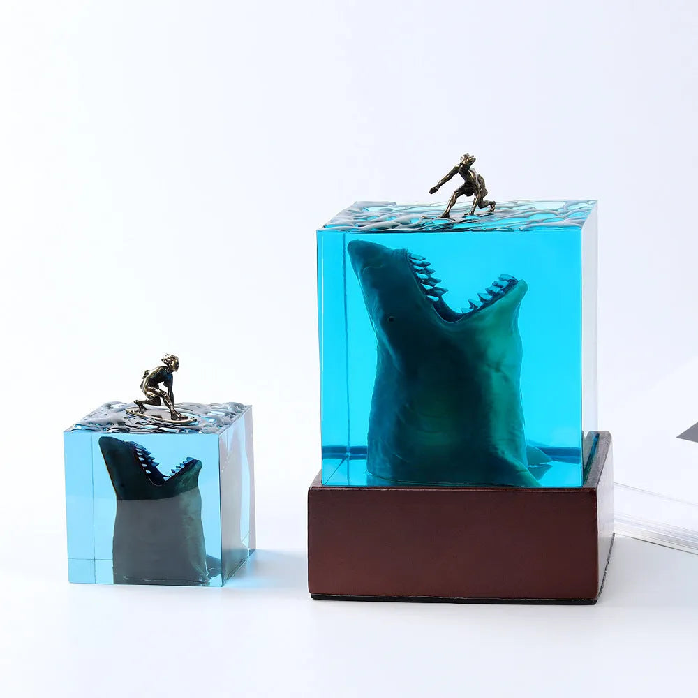 Clear epoxy resin ornament with shark surfing on a wave, includes lamp holder.