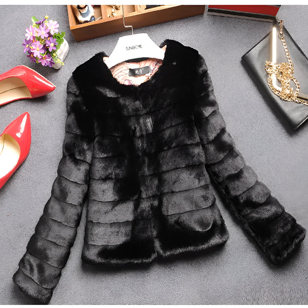 Women's short length faux fur top in beige on a model, showing regular sleeves and streetwear style.
