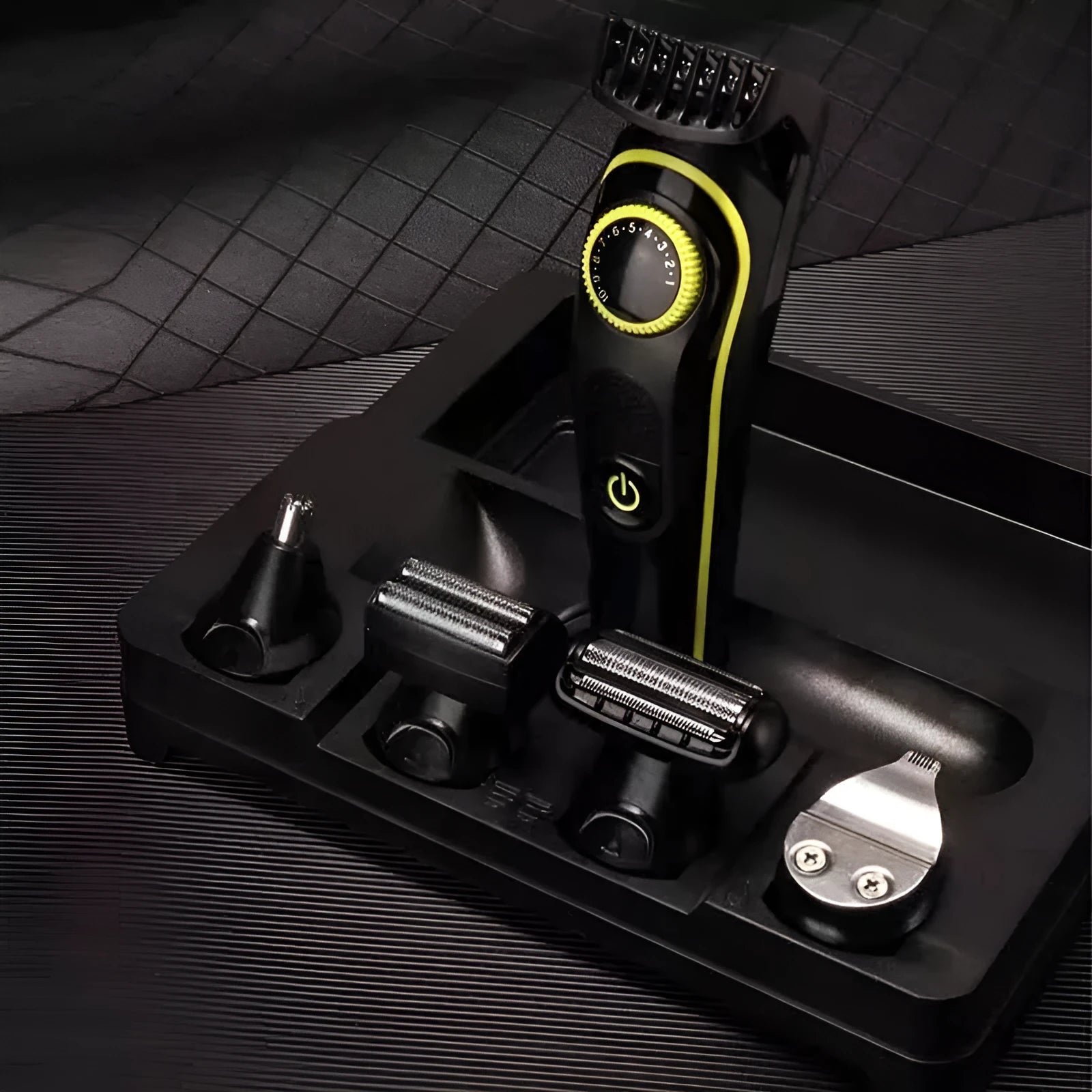 Black rechargeable electric hair clipper set with stainless steel blades, brush, and cloth.