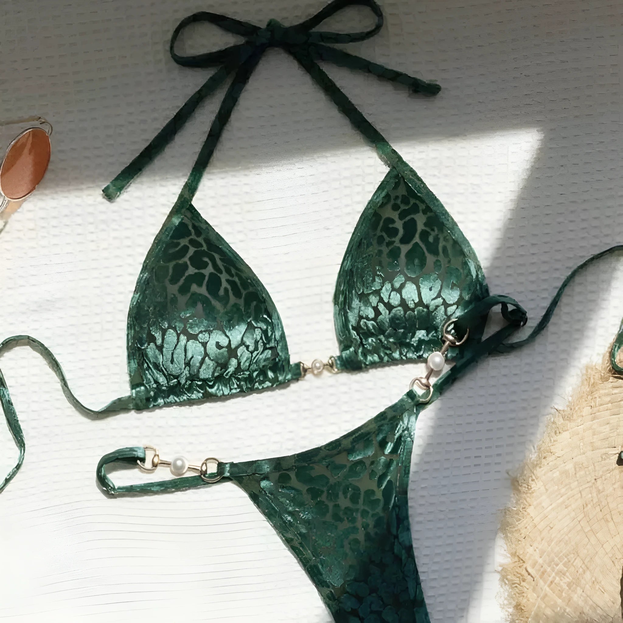 Blue leopard print women's bikini set on a mannequin, showing triangle top and briefs style.