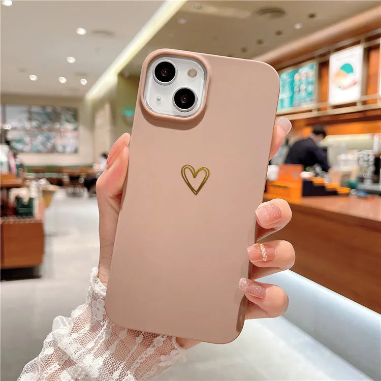 Brown soft silicone iPhone case with a simple cartoon ins style design on a table.