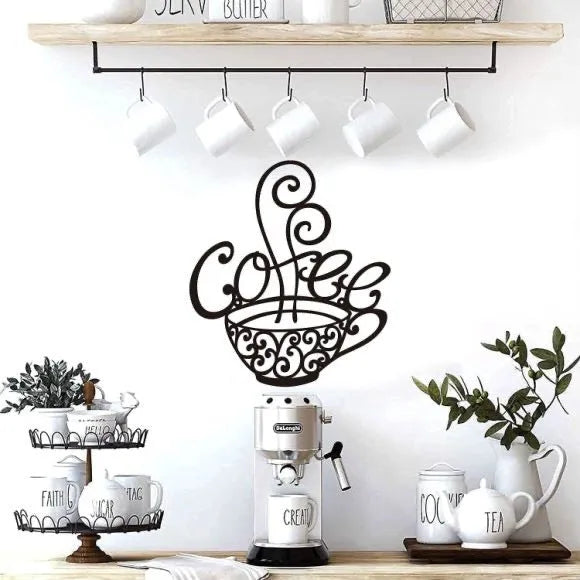 Black wrought iron single-letter silhouette wall decoration on a light wall.