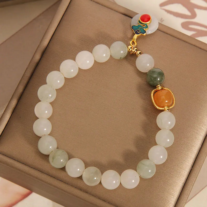 Women's ice jade bracelet with xiangyun peace pattern and pearl accents