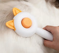Self-cleaning pet grooming brush with stainless steel comb teeth in greenish white and orange white colour options