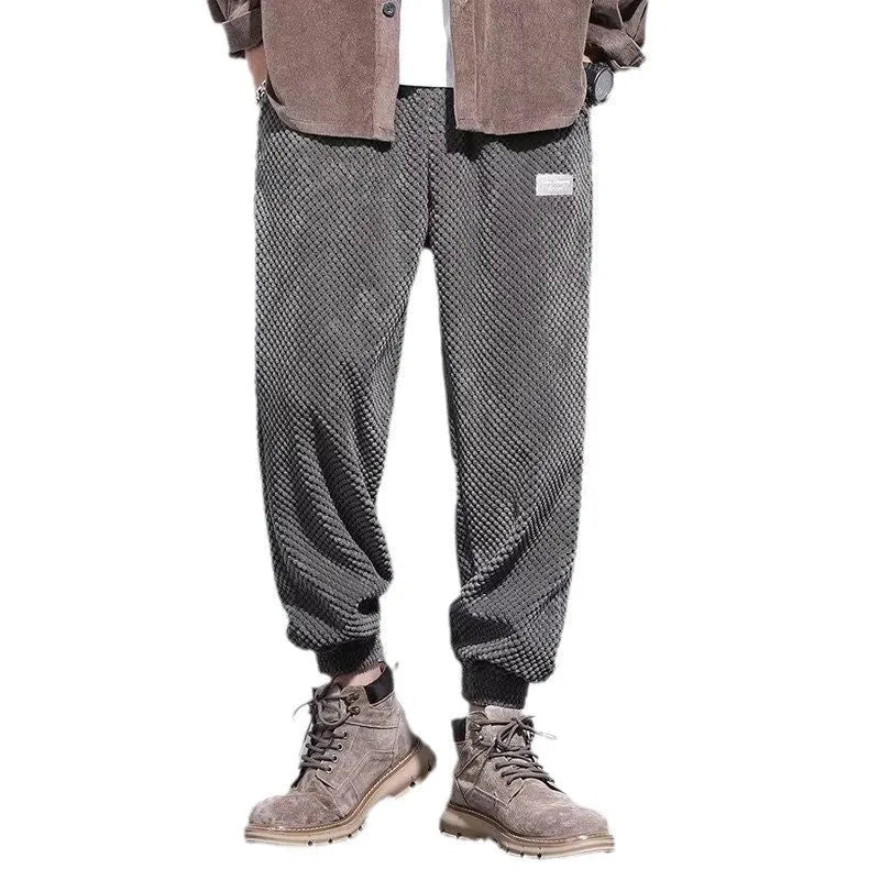 Men's grey ankle-tied sweatpants with a straight leg and non-ironing fabric.