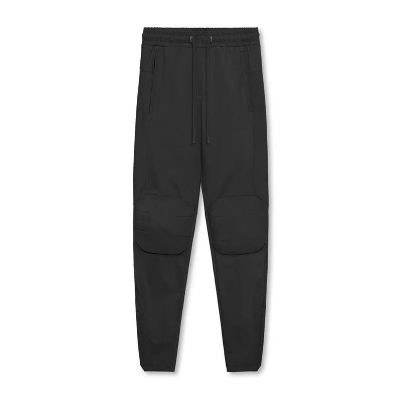 Men's grey loose-fit fitness trousers with ankle ties and quick-drying polyester fabric