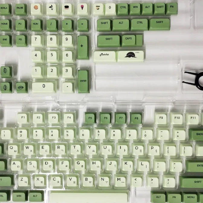 Full set of 124 matcha green PBT keycaps for a mechanical keyboard, showing various international layout options.