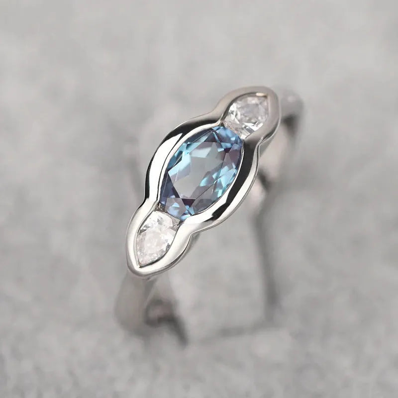Geometric ellipse zircon ring in white gold finish showing structured design and stone detailing