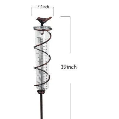 Cast iron garden rain gauge with glass tube and hummingbird decoration, showing 1-20 measurement scale.