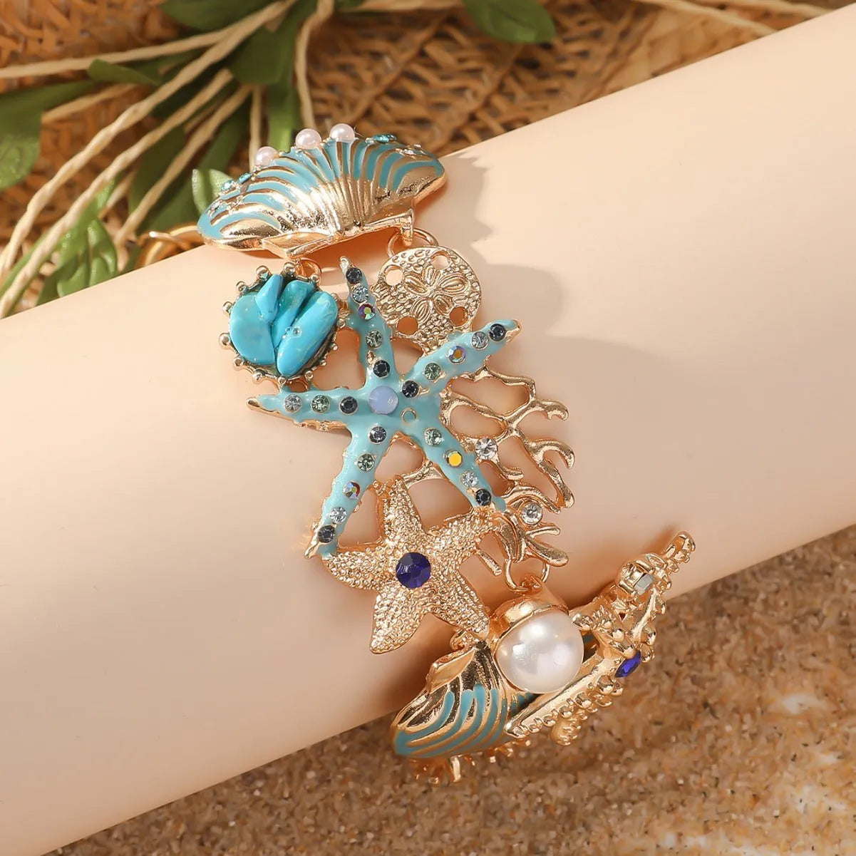 Alloy marine bracelet with boat anchor, star, and starfish rhinestone elements in turquoise, coral red, or coral blue