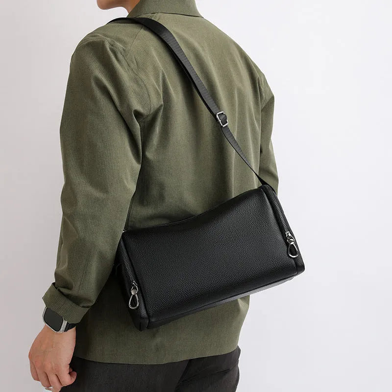 Genuine leather crossbody shoulder bag for men in black with stitching detail and large capacity interior