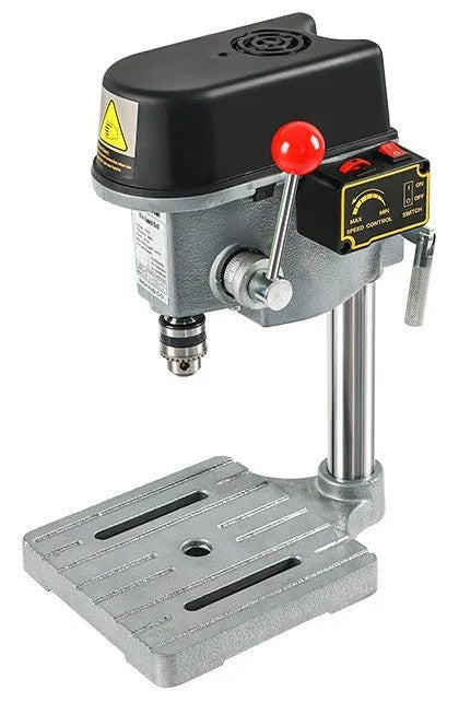 Mini bench drill and milling machine with included 1050W drill and metal bench pliers on a workbench.