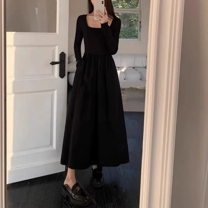 Women's black square collar knitted A-line dress with long sleeves and an elasticated waist.