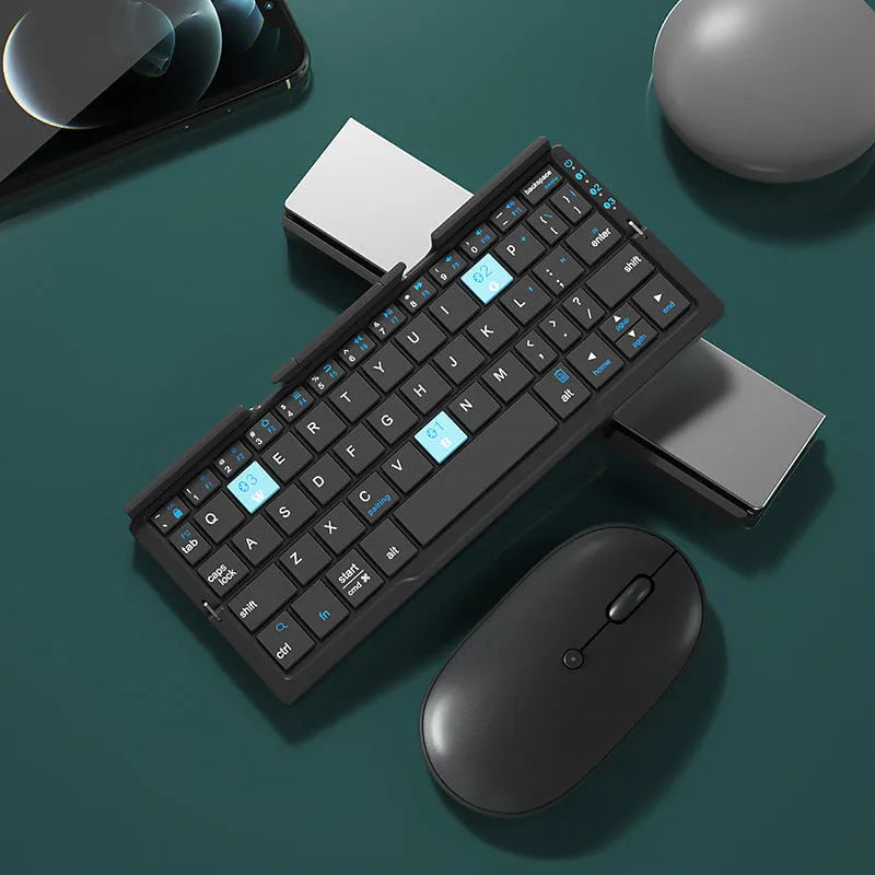 Aluminium folding Bluetooth keyboard in silver white colour showing open typing position and compact folded size