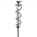 Cast iron garden rain gauge with glass tube and hummingbird decoration, showing 1-20 measurement scale.