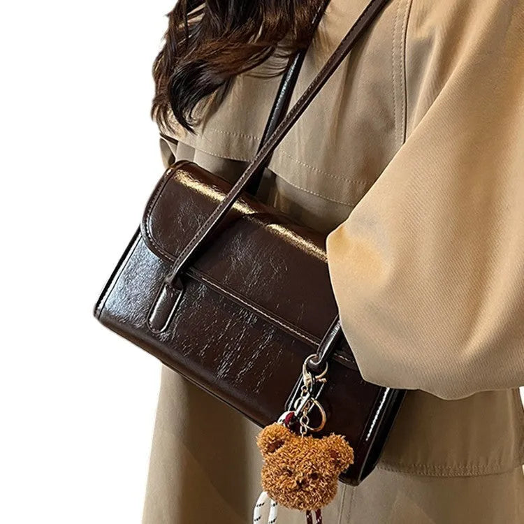 Women's brown PU leather square shoulder bag with decorative pendant and double strap