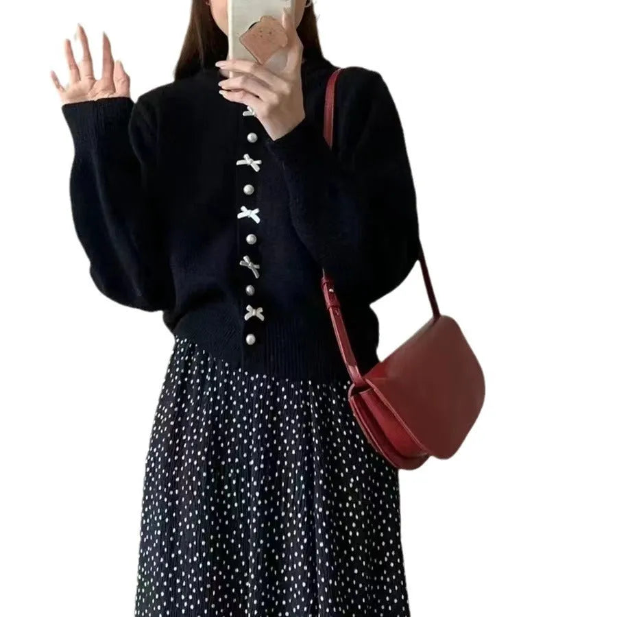 Women's cashmere blend cardigan sweater with pearl buttons and bow detail in solid colour
