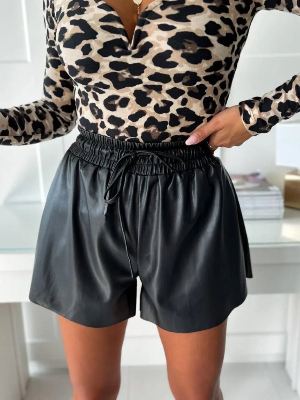 Women's black casual shorts with drawstring lace-up waist and wide-leg cut
