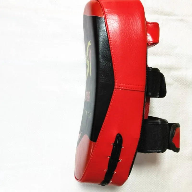 Black and red handheld boxing Sanda foot target with double buckle strap on the back.