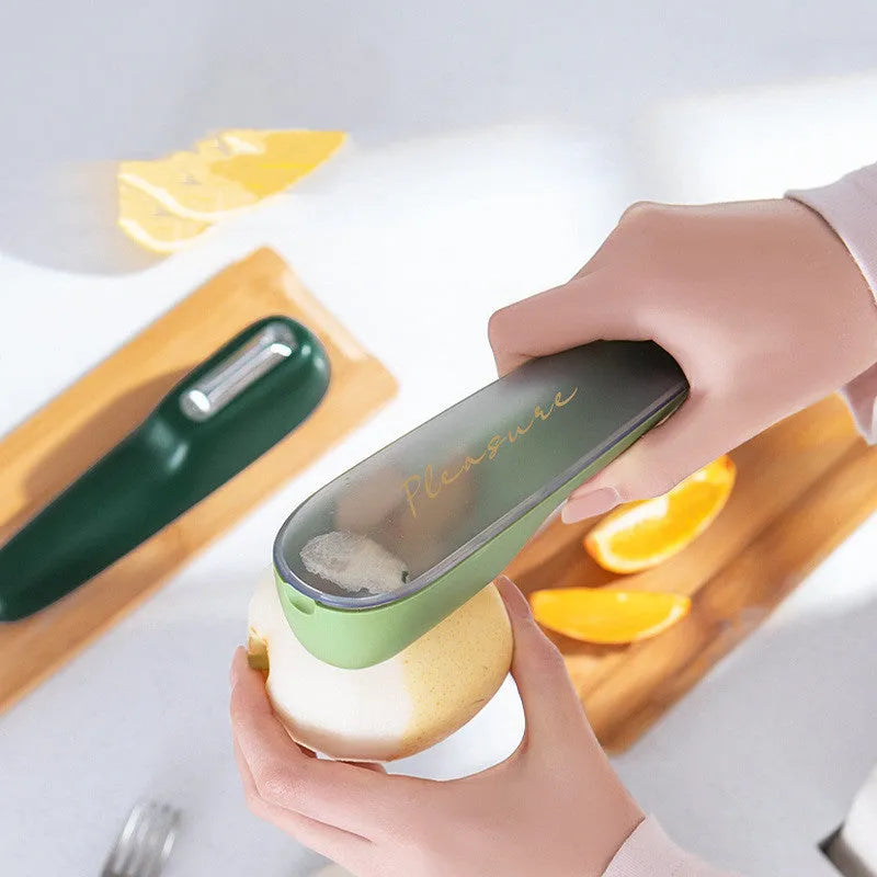 Dark green kitchen peeler with storage tube and stainless steel blade for peeling vegetables and fruit