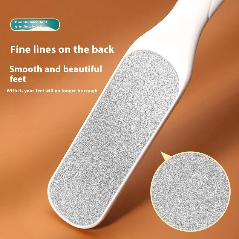 Stainless steel double-sided foot grinder with white and black abrasive heads for callus removal