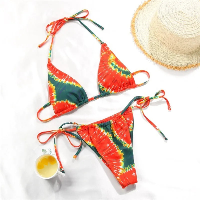 Women's polka dot print split bikini swimsuit in briefs and triangle styles on a mannequin